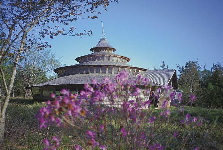 The yurt shown in the three photos on this page is Bills home in the Maine woods. It is 54' (eaves) in diameter and was designed so it could be built over a period of several years and still provide shelter during the process. It is a tri-centric, or three-ring yurt with 2700 sq. ft. of floor space. You can first build the 16' inner core as a room to move into. In the second stage, you can build the large sheltering roof over a gravel pad, allowing the major cost, floor construction, to be delayed. In the meantime you have a spacious area under roof that can be used for a workshop, greenhouse, garage, or for play.