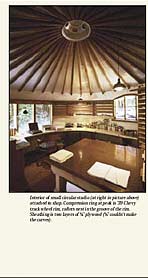 Interior of small circular studio (at right in picture above) attached to shop. Compression ring at peak is '39 Chevy truck wheel rim, rafters nest in the groove of the rim. Sheathing is two layers of 1/4" plywood (1/2" couldn't make the curves).