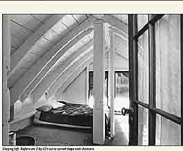 Sleeping loft. Rafters are 2-by-12's cut to curved shape with chainsaw.