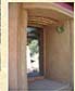 Clay and straw molding around window in straw bale walls. Arch over the window was formed by making a lightweight frame out of split bamboo and covered with mixture of clay and straw.